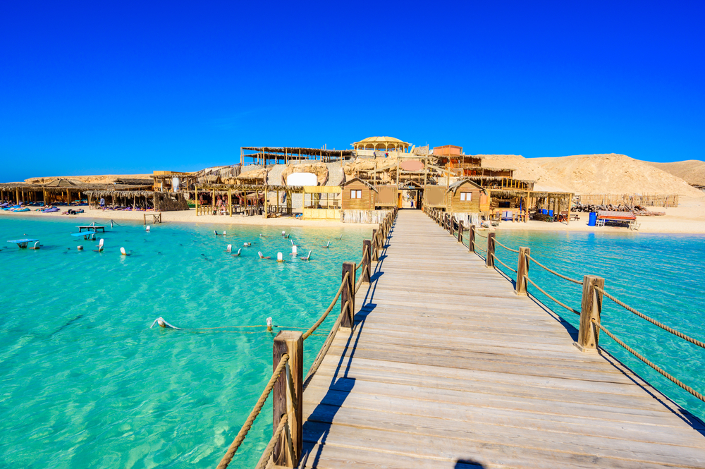 Wooden,Pier,At,Orange,Bay,Beach,With,Crystal,Clear,Azure